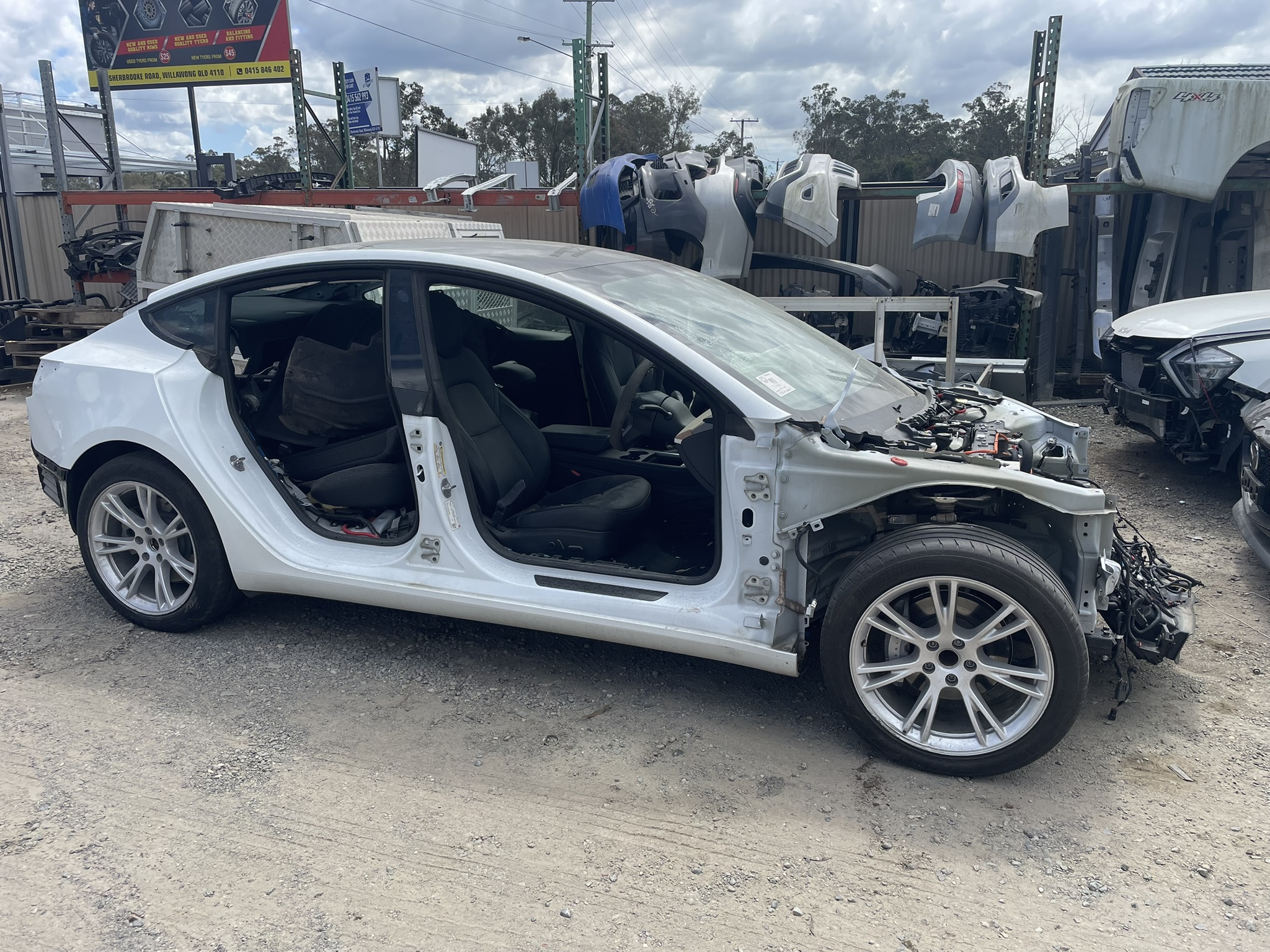Written-off Tesla EV — the battery pack underneath still has 70–80% capacity remaining
